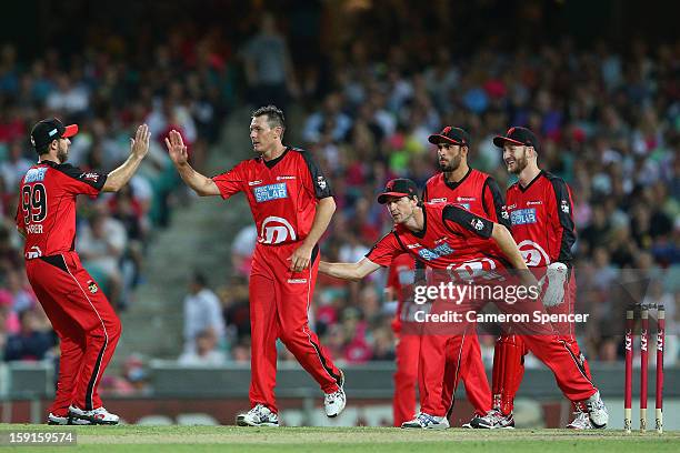 Darren Pattinson of the Renegades is congratulated by team mates after dismissing Stephen O'Keefe of the Sixers during the Big Bash League match...