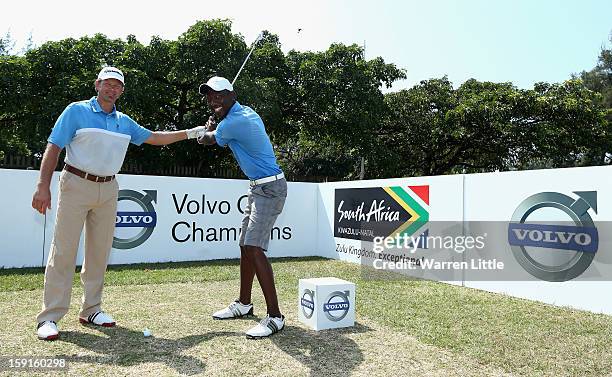 Retief Goosen poses with Siyanda Mwandla from Shakaskraal Township as he hosts a development golf clinic for 28 of the South African Golf Development...