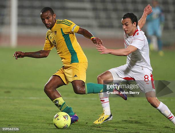 Adane Girma of Ethiopia is challenged by Chadi Hammami of Tunisia during the international friendly game between Tunisia and Ethiopia at the Al...