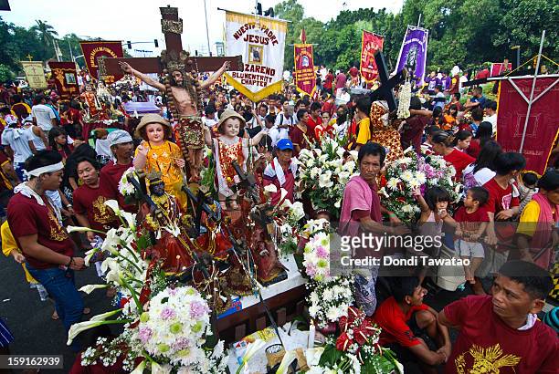 Black Nazarene replicas join the parade of millions of Catholic devotees converging in Quiapo for the 406th feast of The Black Nazarene on January 9,...