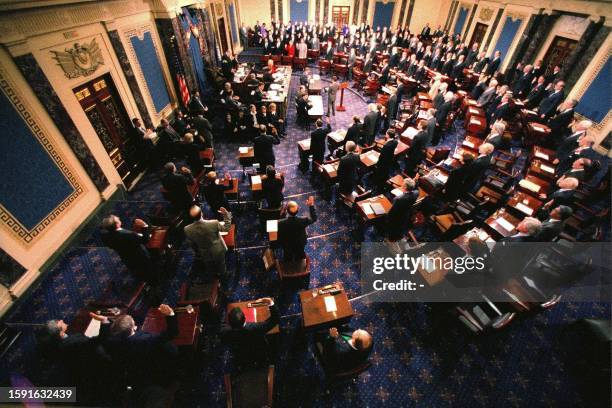 One hundred US senators are sworn in as jurists by presiding judge, US Supreme Court Chief Justice William Rehnquist, 07 January on Capitol Hill in...