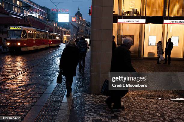 City tram passes a Unicredit Bank Czech Republic SA office in Prague, Czech Republic, on Tuesday, Jan. 8, 2013. The Czech economy is showing weak...