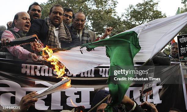 Activists from opposition Bharatiya Janata Party shout anti-Pakistan slogans during a protest march to the Pakistani embassy against the killing of...