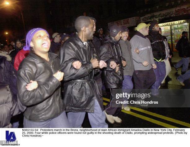Protesters march in the Bronx, neighborhood of slain African immigrant Amadou Diallo in New York City, February 25, 2000. Four white police officers...