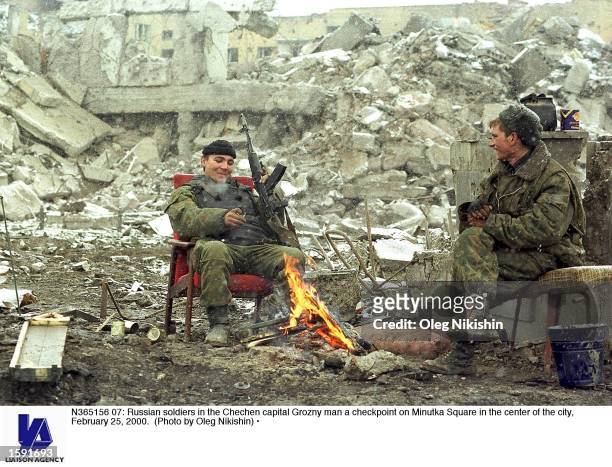Russian soldiers in the Chechen capital Grozny man a checkpoint on Minutka Square in the center of the city, February 25, 2000.