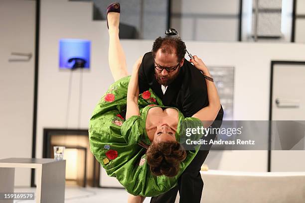 Actress Alessija Lause and actor Nikolaus Szentmiklosi perform during the 'Geruechte...Geruechte...' photo rehearsal at Komoedie am Kurfuerstendamm...