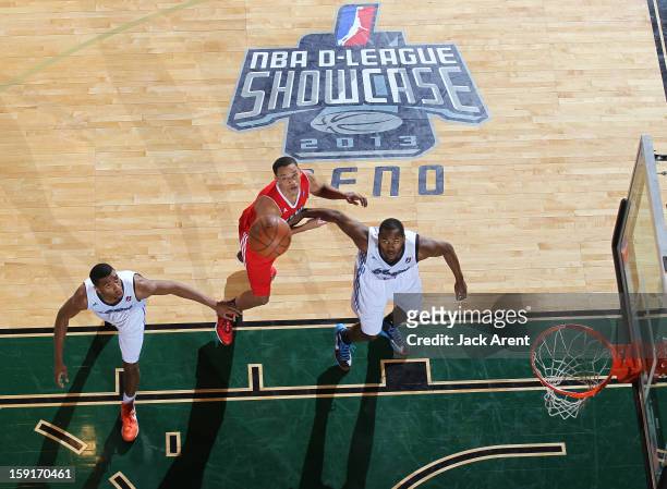 Hollis Thompson, Rodney Bartholomew of the Tulsa 66ers and Omar Reed of the Main Red Claws look to rebound the ball during the 2013 NBA D-League...