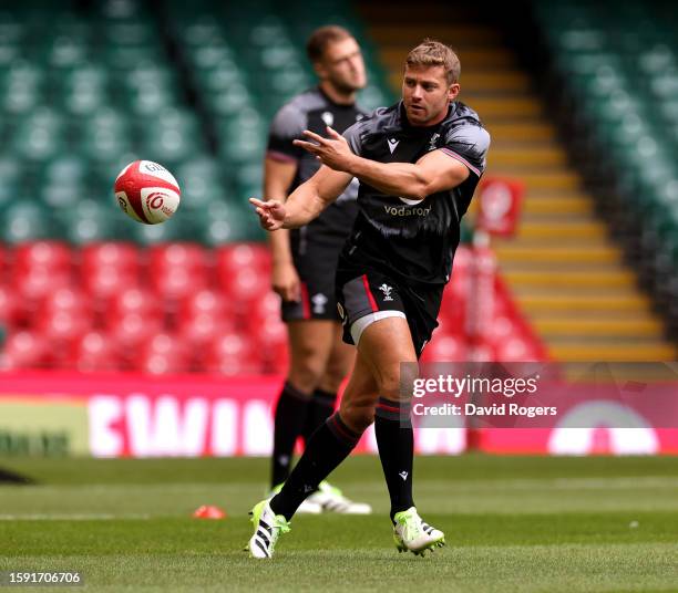 Leigh Halfpenny passes the ball during the Wales Captain's Run ahead of the Summer International match between Wales and England at the Principality...