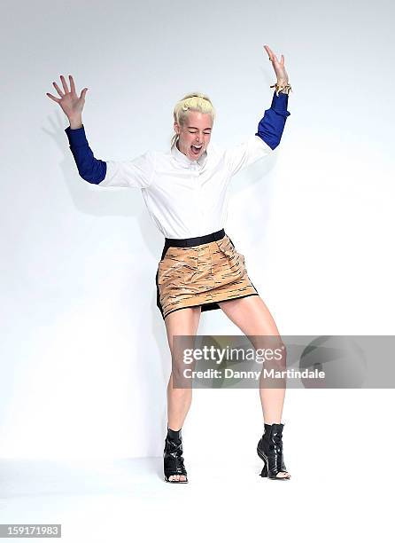 Katie Eary takes the aplause on the catwalk at the end of her show during the London Collections: MEN AW13 at The Hospital Club on January 9, 2013 in...