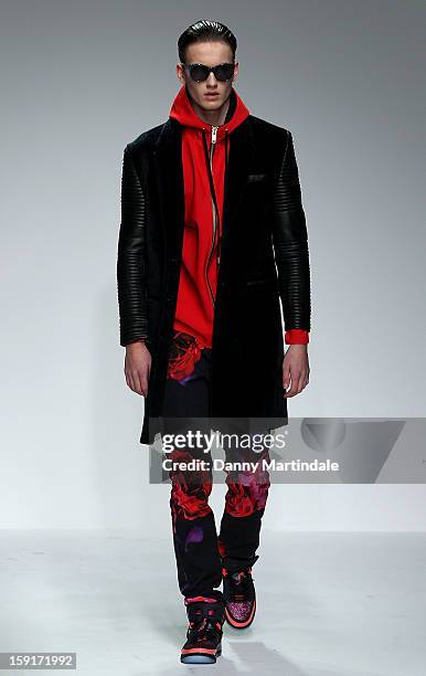 Model walks the catwalk at the Katie Eary show at the London Collections: MEN AW13 at The Hospital Club on January 9, 2013 in London, England.