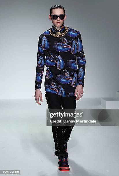 Model walks the catwalk at the Katie Eary show at the London Collections: MEN AW13 at The Hospital Club on January 9, 2013 in London, England.