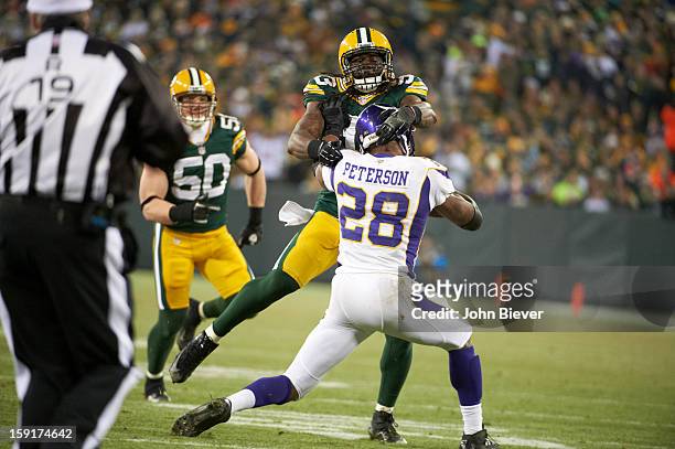 Playoffs: Rear view of Minnesota Vikings Erik Walden in action, rushing vs Green Bay Packers B.J. Raji at Lambeau Field. Green Bay, WI 1/5/2013...