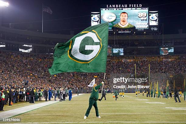Playoffs: Green Bay Packers cheerleader waving flag on field during game vs Minnesota Vikings at Lambeau Field. Green Bay, WI 1/5/2013 CREDIT: John...