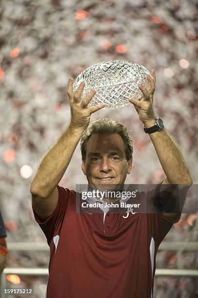 National Championship: Closeup of Alabama coach Nick Saban victorious, holding up AFCA The Coaches' Trophy after winning game vs Notre Dame at Sun...