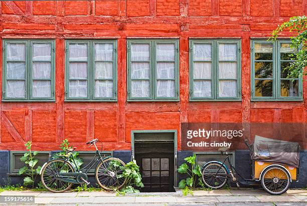 old red house front - copenhagen bicycle stock pictures, royalty-free photos & images