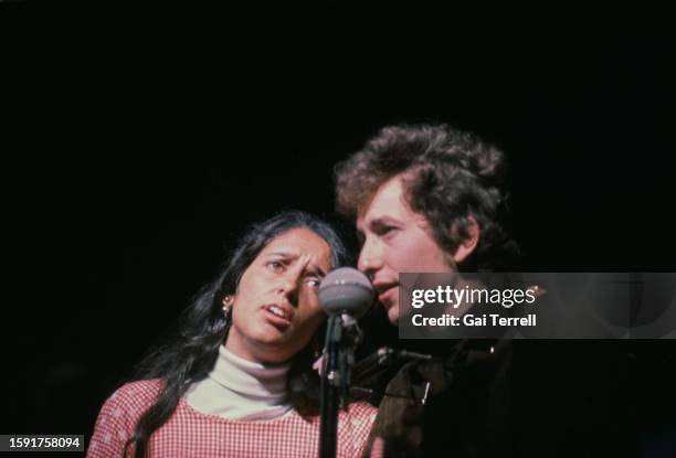 Joan Baez and Bob Dylan performing at the Newport Folk Festival at Freebody Park on Rhode Island, USA, 23rd-26th July 1964.