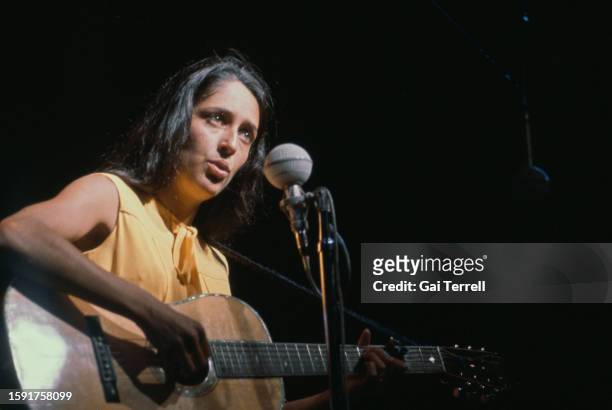 American singer and songwriter Joan Baez performing at the Newport Folk Festival at Freebody Park on Rhode Island, USA, 23rd-26th July 1964.