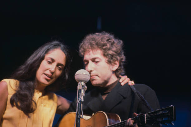Joan Baez and Bob Dylan performing at the Newport Folk Festival at Freebody Park on Rhode Island, USA, 23rd-26th July 1964.