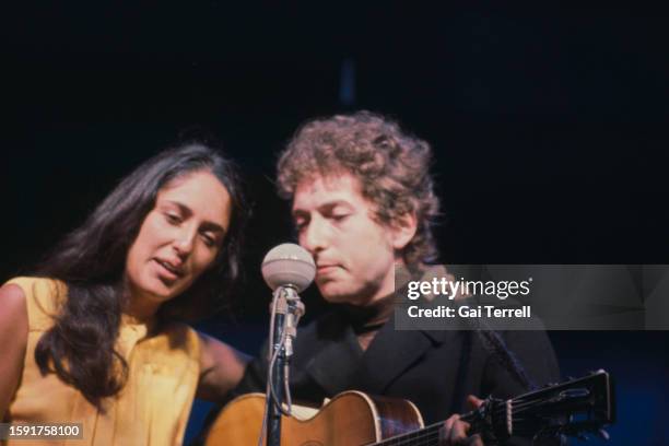 Joan Baez and Bob Dylan performing at the Newport Folk Festival at Freebody Park on Rhode Island, USA, 23rd-26th July 1964.