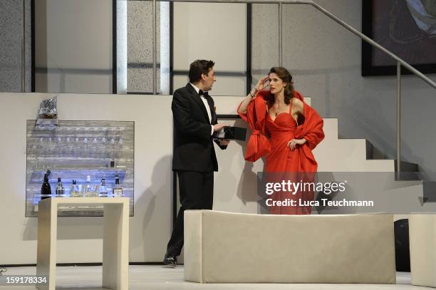 Ivan Vrgoc and Julia Bremermann perform during the 'Geruechte...Geruechte...' photo rehearsal at Komoedie am Kurfuerstendamm Theater on January 9,...