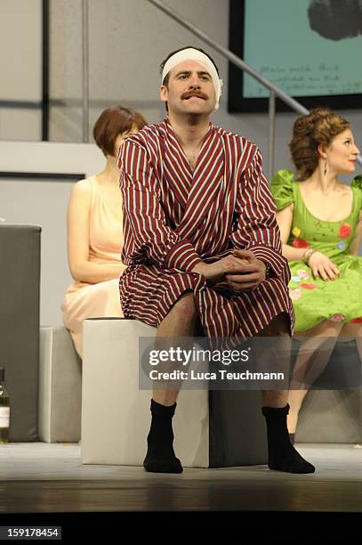 Nikolaus Szentmiklosi performs during the 'Geruechte...Geruechte...' photo rehearsal at Komoedie am Kurfuerstendamm Theater on January 9, 2013 in...