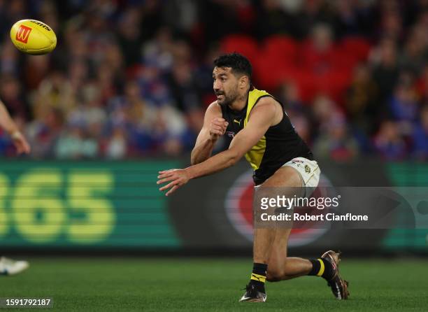 Marlion Pickett of the Tigers handballs during the round 21 AFL match between Western Bulldogs and Richmond Tigers at Marvel Stadium, on August 04 in...