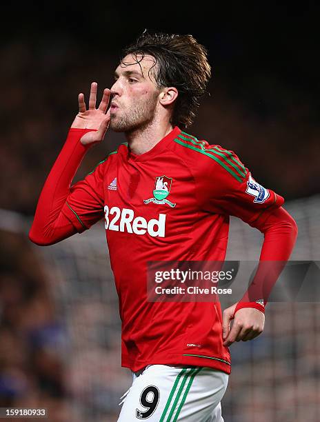 Michu of Swansea City celebrates scoring the opening goal during the Capital One Cup Semi-Final first leg match between Chelsea and Swansea City at...