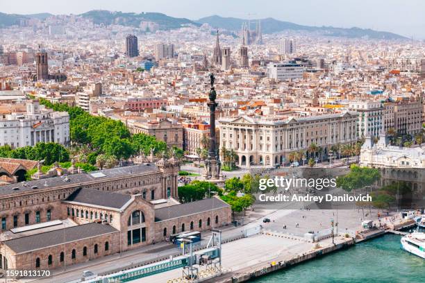 panoramic view of barcelona from above with landmarks and coastline. - torre agbar stock pictures, royalty-free photos & images