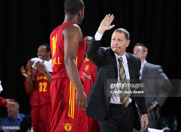 Nick Nurse Head Coach of the Fort Wayne Mad Ants high-fives Tony Mitchell while playing against the Rio Grande Valley Vipers during the 2013 NBA...