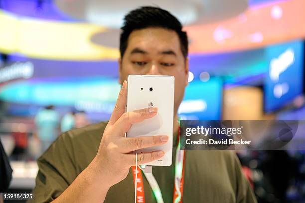 An attendee uses the Huawei Ascend Mate ''phablet'' at the 2013 International CES at the Las Vegas Convention Center on January 9, 2013 in Las Vegas,...