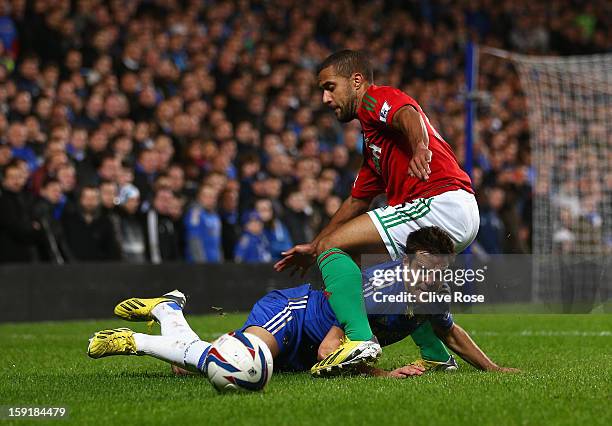 Cesar Azpilicueta of Chelsea goes to ground after a challenge by Wayne Routledge of Swansea City during the Capital One Cup Semi-Final first leg...