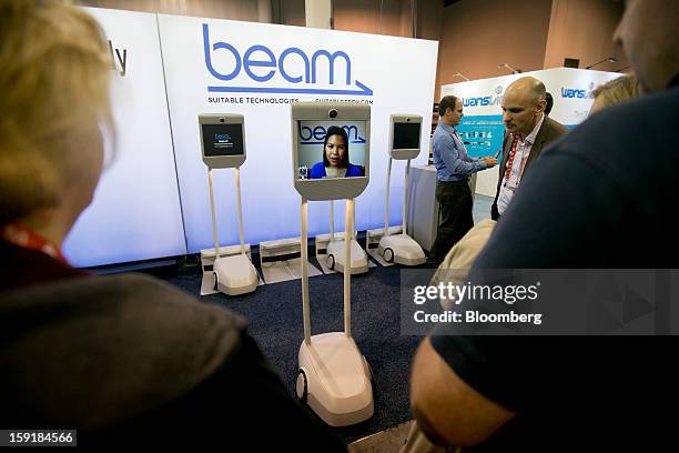 Suitable Technologies "Beam" remote presence system interacts with attendees during the 2013 Consumer Electronics Show in Las Vegas, Nevada, U.S., on...