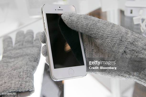 Moshi "Digits" touch screen gloves are displayed during the 2013 Consumer Electronics Show in Las Vegas, Nevada, U.S., on Wednesday, Jan. 9, 2013....