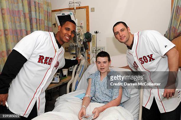 Boston Red Sox rookies Xander Bogaerts and Alex Hassan spread cheer to Jack at Boston Children's Hospital on January 9, 2013 in Boston, Massachusetts.