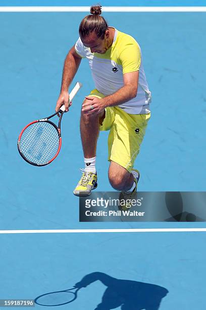 Xavier Malisse of Belgium leaps up off the court in his quarterfinal match against Philipp Kohlschreiber of Germany during day four of the Heineken...