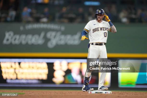 Brice Turang of the Milwaukee Brewers celebrates at second base in the fifth inning against the Cincinnati Reds at American Family Field on July 26,...