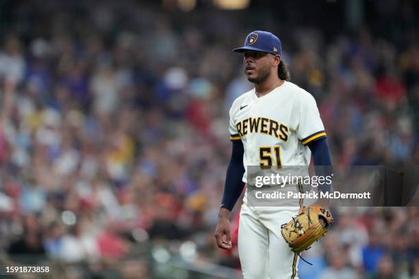 Freddy Peralta of the Milwaukee Brewers walks back to the dugout after the top of the sixth inning against the Cincinnati Reds at American Family...