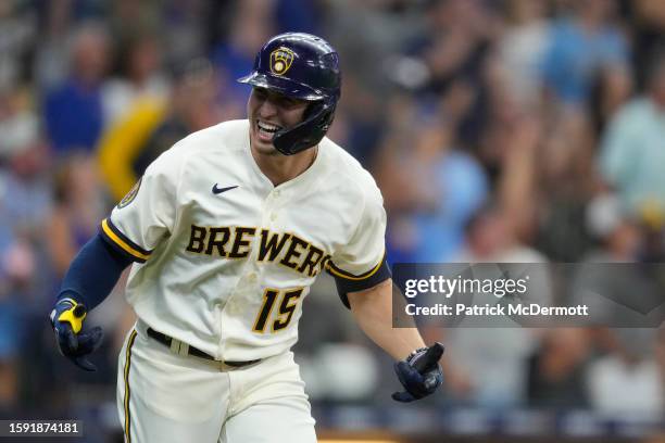 Tyrone Taylor of the Milwaukee Brewers celebrates as he runs the bases after hitting a two-run home run in the seventh inning against the Cincinnati...
