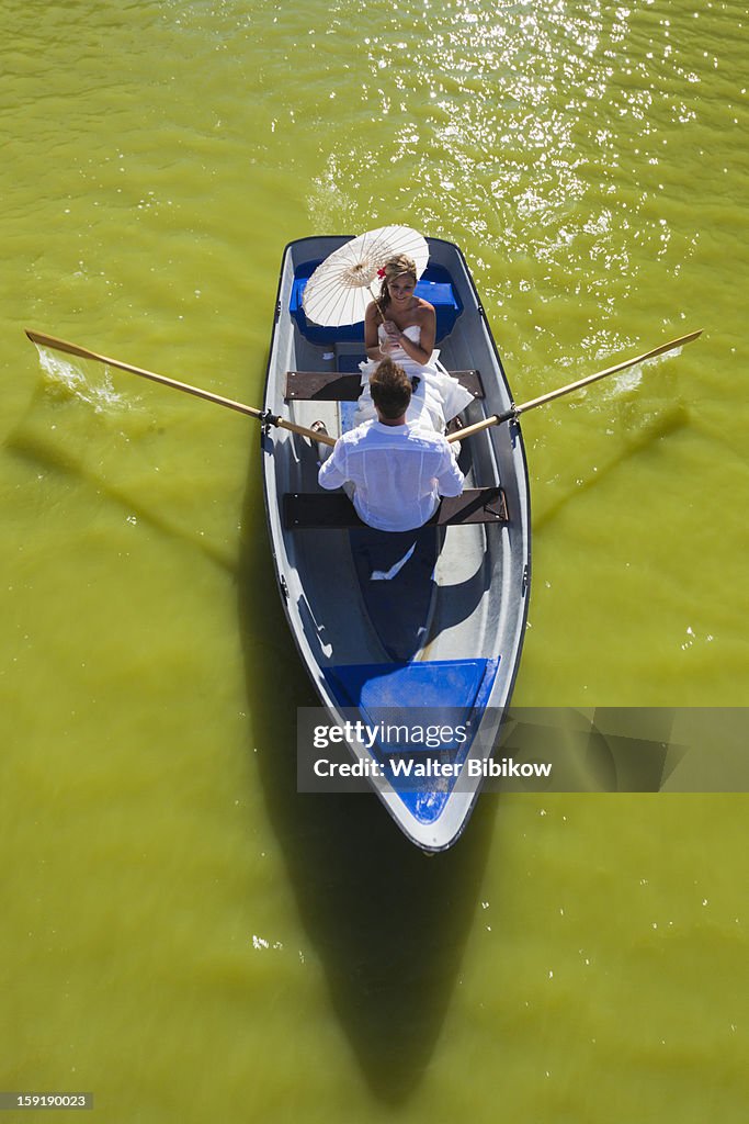 Young man and woman in rowboat