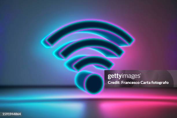3d wifi icon illuminated by neon lights - wifi stockfoto's en -beelden
