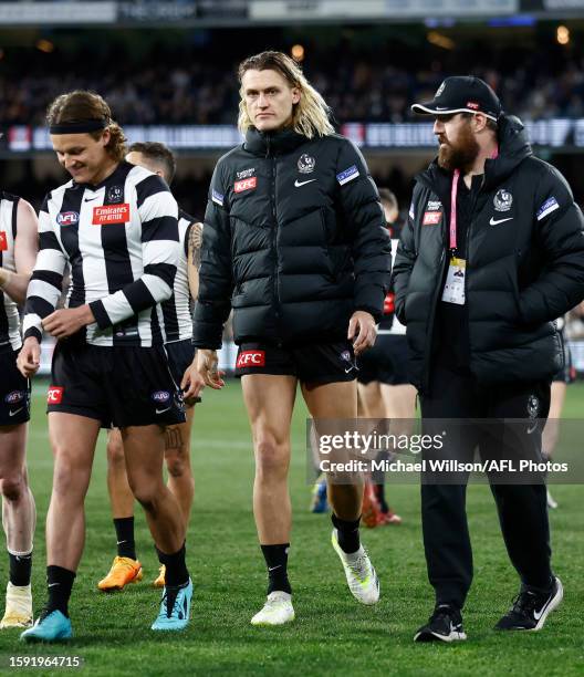 Darcy Moore of the Magpies is seen after being subbed from the game with a leg injury during the 2023 AFL Round 22 match between the Collingwood...