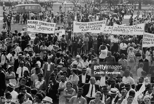 Crowd of people, some holding banners reading 'Oakland Committee for Social Justice, Chicago, Ill', 'Chicago Conference on Religion and Race', and...