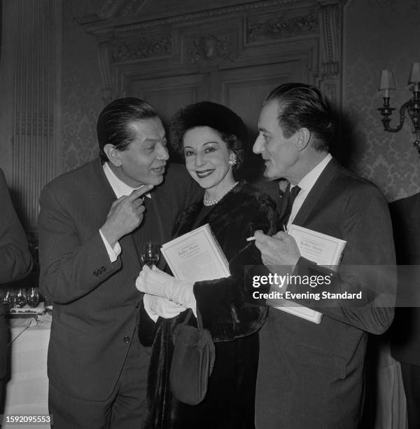 Ballet dancers Serge Lifar , Alicia Markova and Anton Dolin attending an event, January 19th 1959. Markova and Dolin are holding copies of Humphrey...