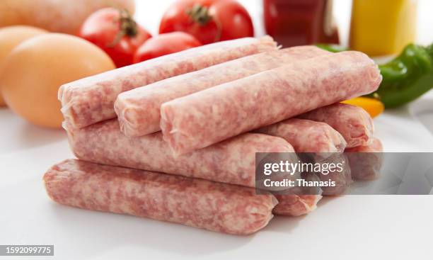 breakfast sausages against a white background - sausage stock pictures, royalty-free photos & images