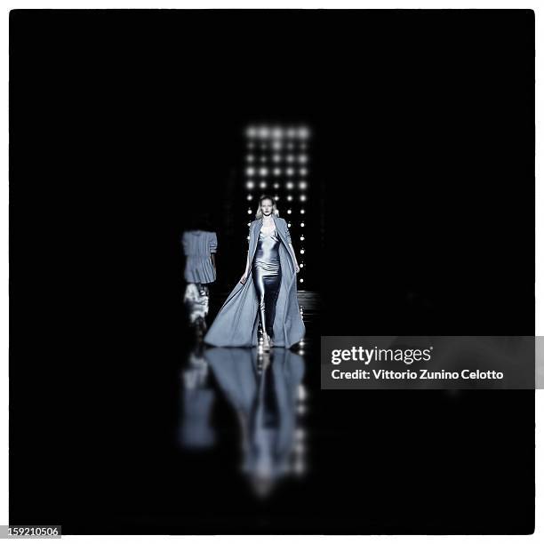 Model walks the runway during the Ermanno Scervino fashion show as part of Pitti Immagine Uomo 83 at Palazzo Vecchio on January 9, 2013 in Florence,...