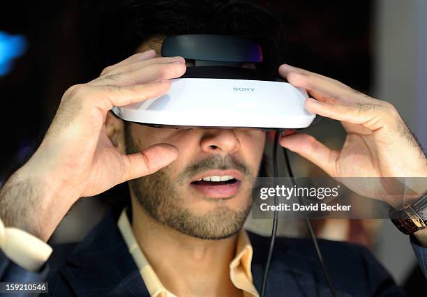 An attendee uses a Sony personal 3D viewer at the 2013 International CES at the Las Vegas Convention Center on January 9, 2013 in Las Vegas, Nevada....