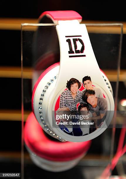 An image of the band, One Direction, covers a pair of headphones at the Jazwares booth at the 2013 International CES at the Las Vegas Convention...