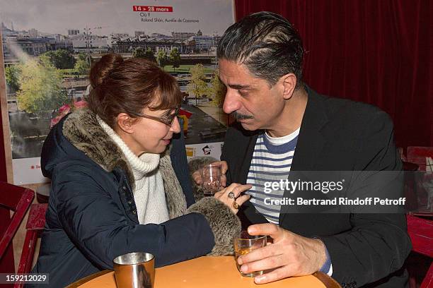 Actors Simon Abkarian and Ariane Ascaride share a drink after Abkarian performed on stage during the premiere of 'Menelas rebetiko rapsodie' he wrote...