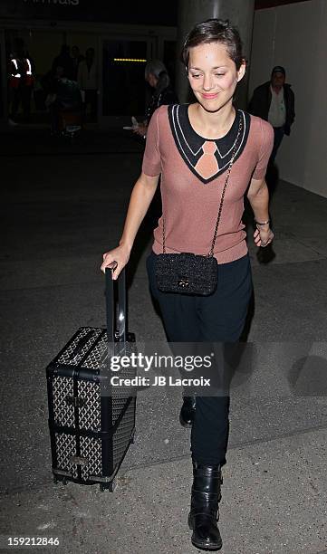 Marion Cotillard is seen at LAX Airport on January 9, 2013 in Los Angeles, California.