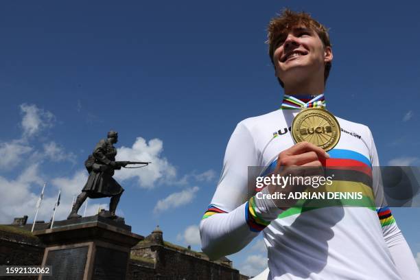 Australia's Oscar Chamberlain celebrates with his gold medal after winning the men's Junior Individual Time Trial in Stirling during the UCI Cycling...